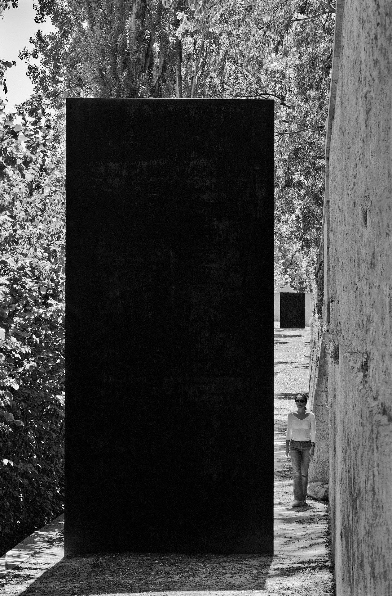 Two steel sculptures by Richard Serra titled Walking is Measuring, dated 1999-2000.